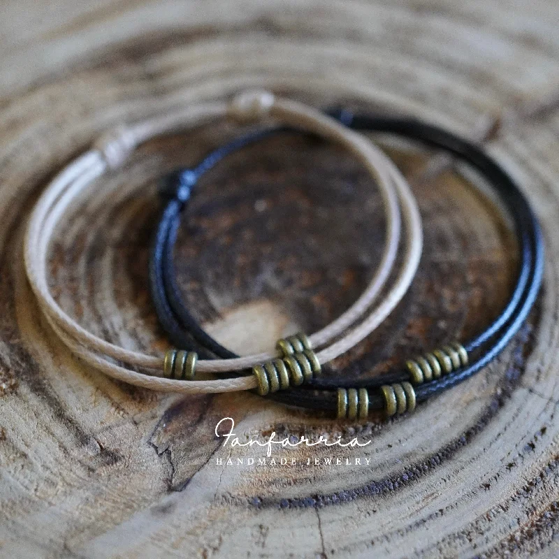 women rose gold bangles -Turner Black and Tan Couple Bracelets Bronze accents